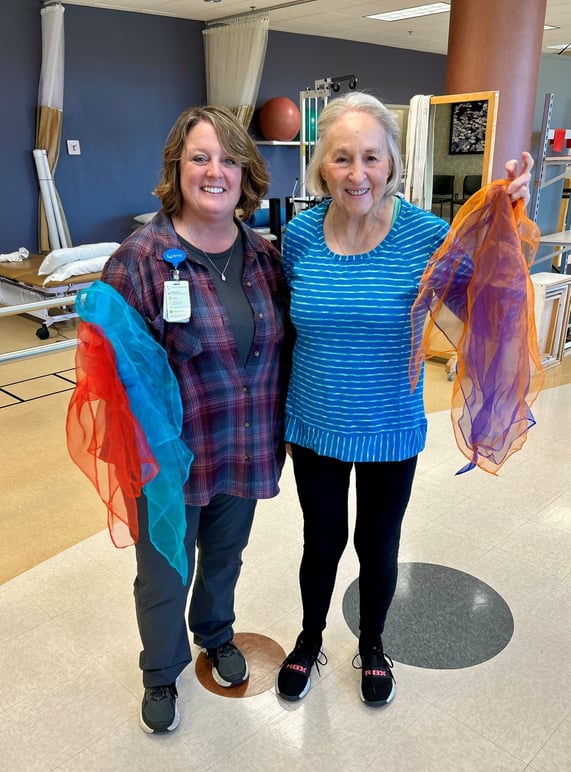 Michelle Anderson and Betty Robinson holding scarves