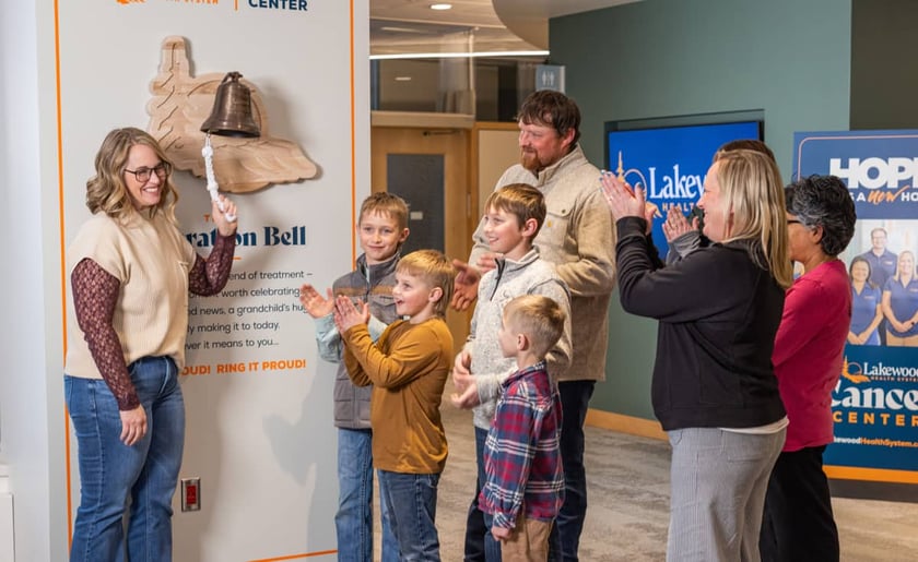 cancer-patient-rings-celebration-bell-surrounded-by-family-at-lakewood-cancer-center