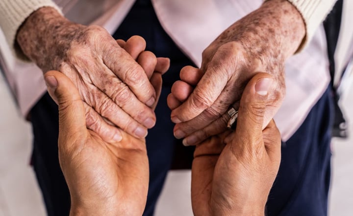 close_up_of_mature_and_youthful_hands