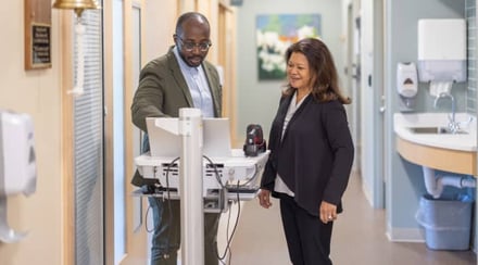 doctor-and-patient-consult-in-medical-hallway