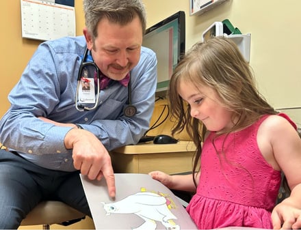 dr_bratney_reading_a_book_with_a_child