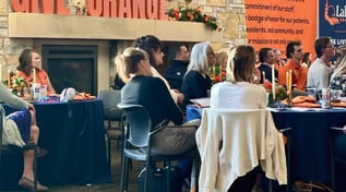 guests-seated-at-tables-during-lakewood-give-orange-fundraising-event