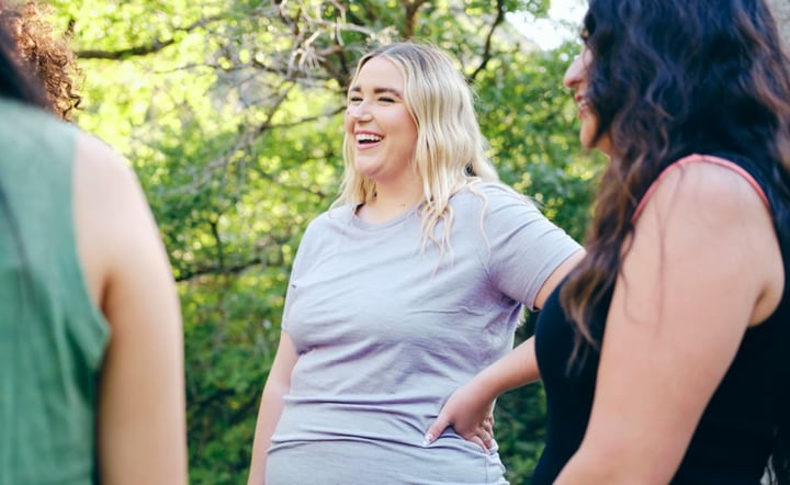 A group of women enjoying active lifestyle time outdoors in a nature environment.