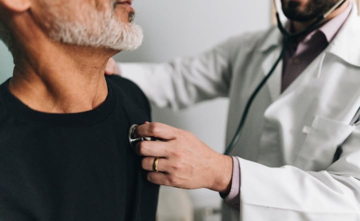 Close-up of a doctor examining a patient in a hospital