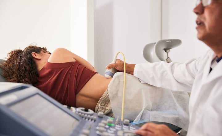 Woman laying on medical table getting an ultrasound