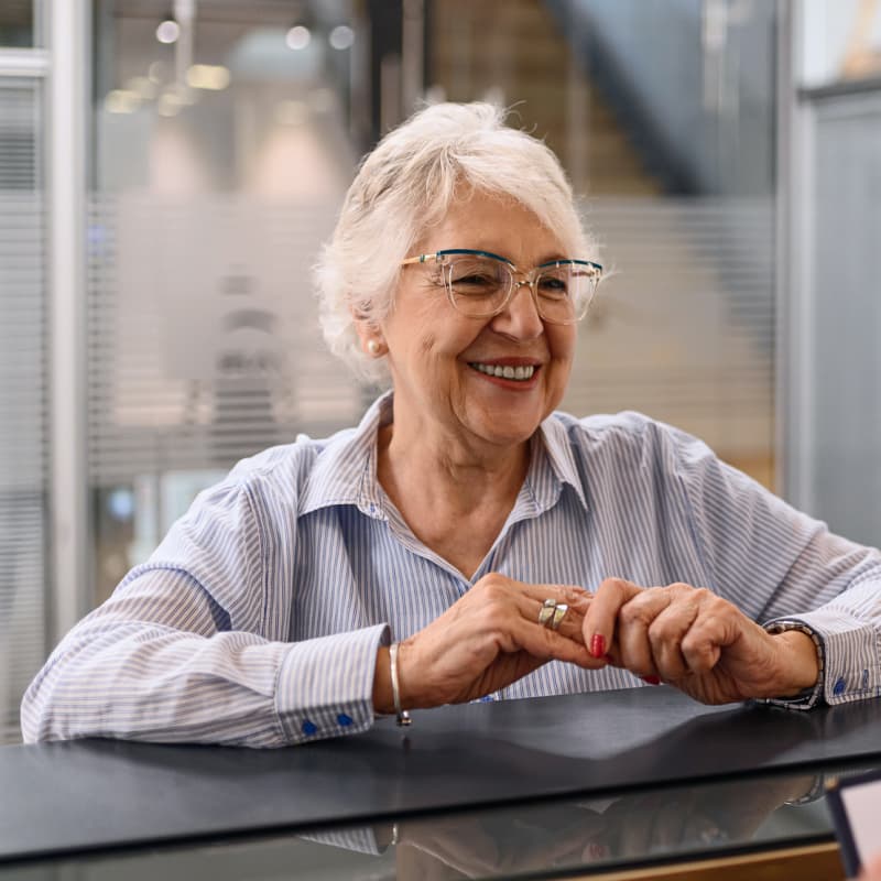 senior_woman_at_reception_counter